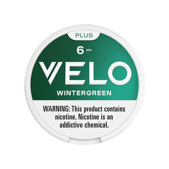 Velo Plus Wintergreen smokeless nicotine pouches in a white container with green wintergreen flavor branding.
