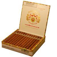 Macanudo Café premium cigar resting on a wooden surface, showcasing its smooth, light-colored wrapper and elegant packaging.