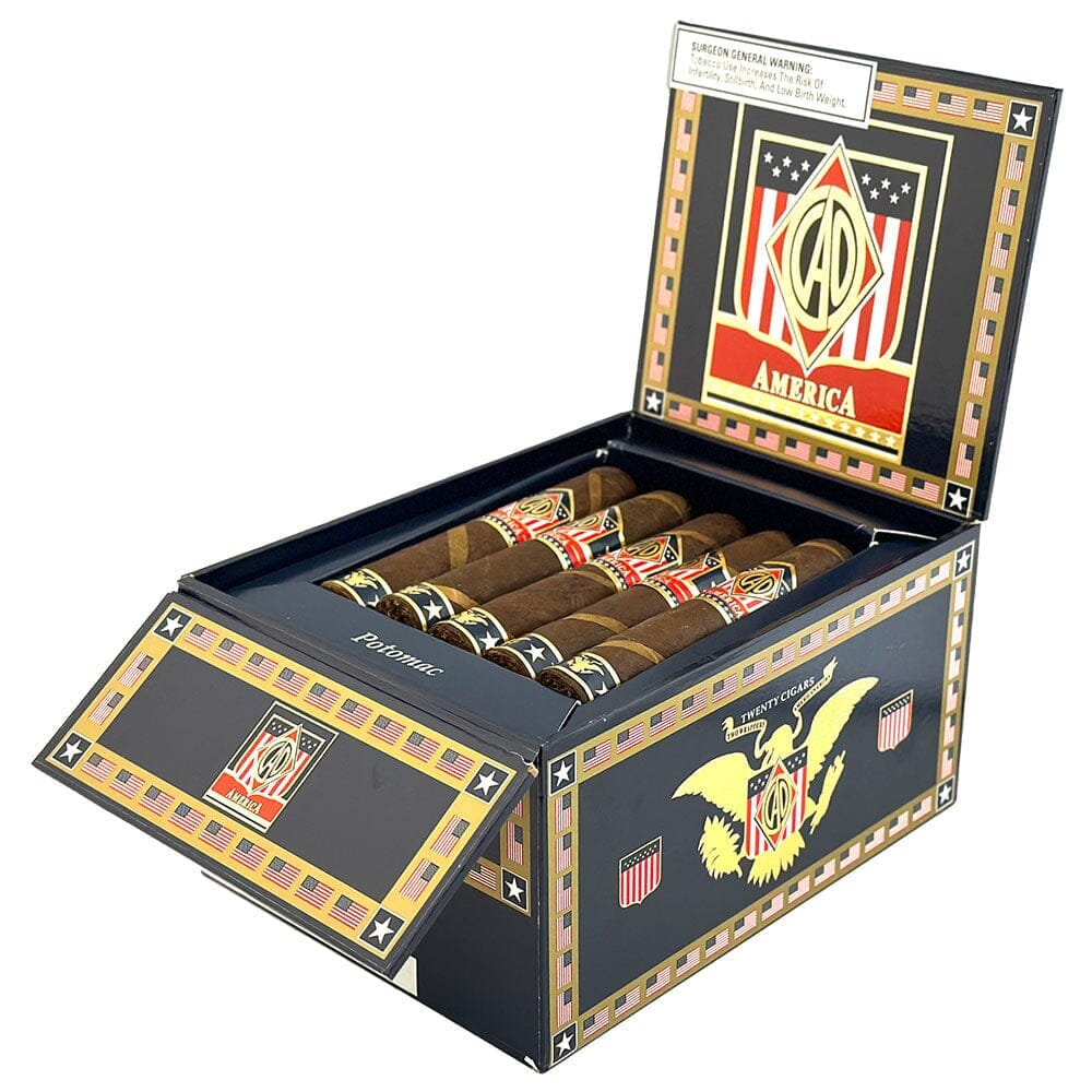Open box of CAO America Premium Cigars showing partially wrapped, high-quality cigars from the CAO brand.