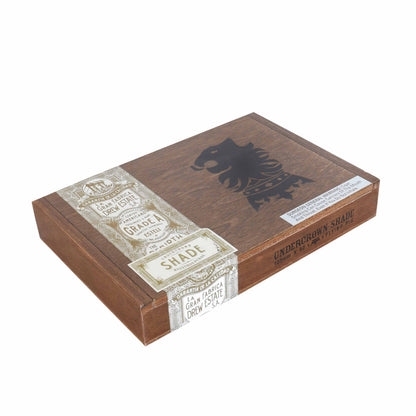Undercrown Shade premium cigar featuring a closed band, showcasing smooth wrapper and detailed branding with a flying pig logo.
