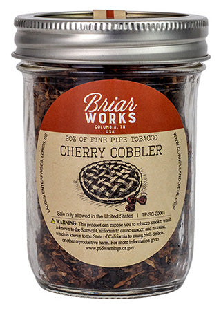 Briarworks Cherry Cobbler pipe tobacco in a resealable pouch with the product label visible.