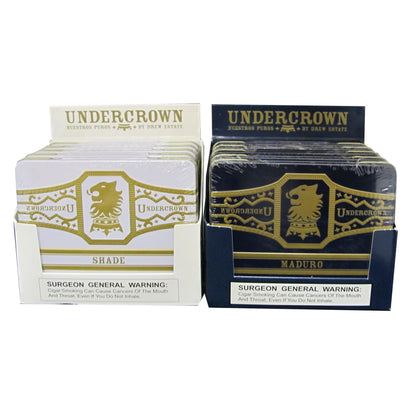 Two tins of Undercrown premium cigars from the Undercrown brand, showcasing the packaging design and branding.