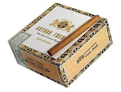 Arturo Fuente Curly Head premium cigar resting on a wooden surface, showcasing its dark, oily wrapper and classic band.