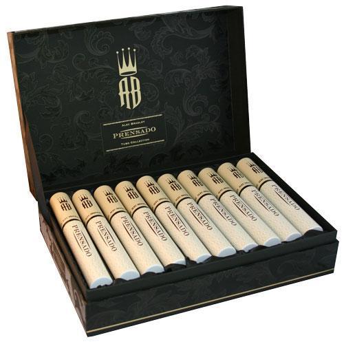 A box of Alec Bradley Prensado Premium Cigars with several cigars inside, showcasing the packaging and cigar bands.
